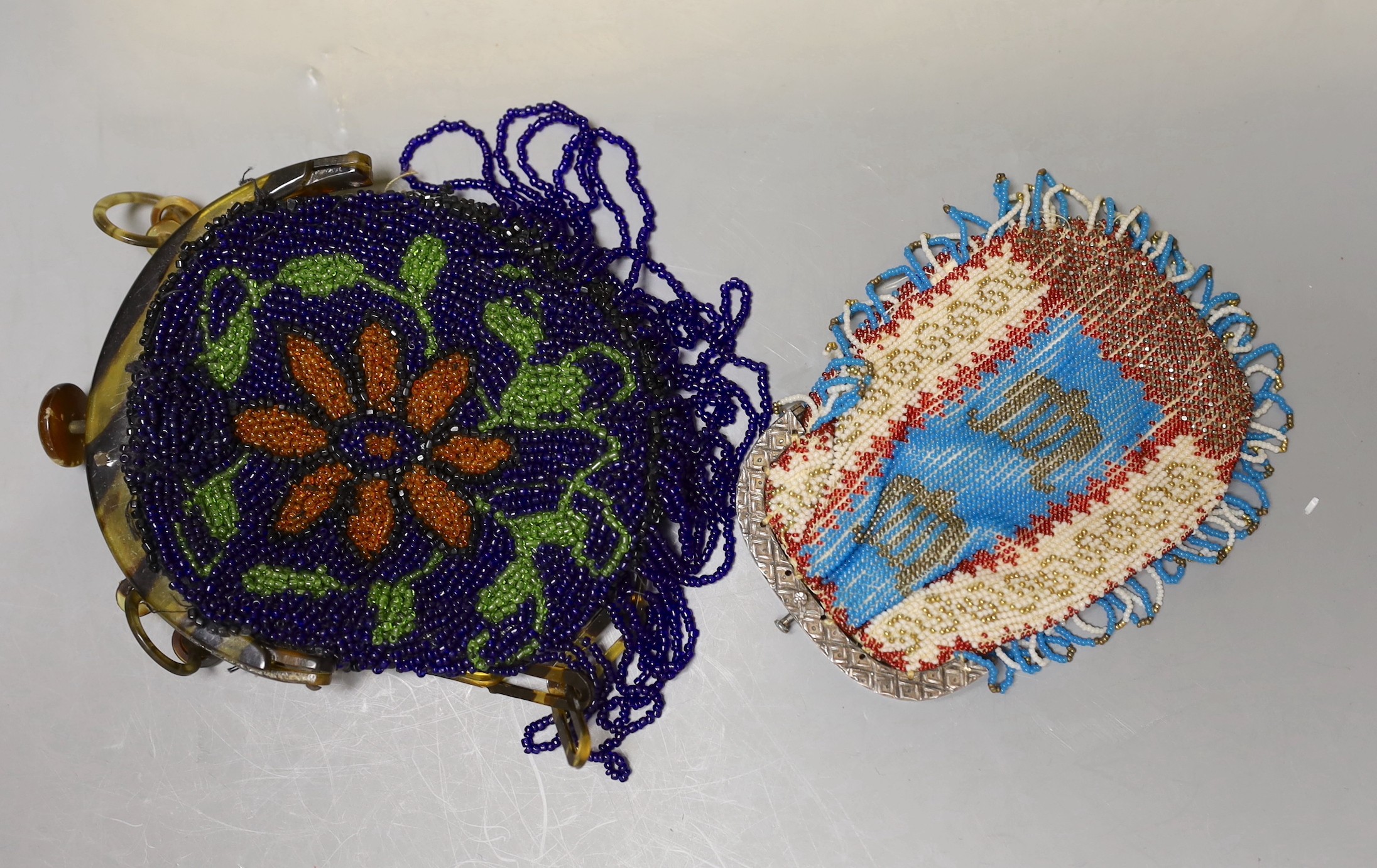 A collection of beadwork purses and bags from early 1900’s, including a W W I bead-worked purse dated 1916 with a steel frame surmounted with a building as the clasp, three beadwork bible bags, five beadwork purses and a